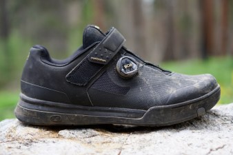 Black Crankbrothers Mallet BOA clipless mountain bike shoe side profile sitting on a rock.