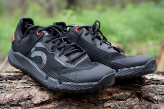 Black Five Ten Trailcross LT mountain bike shoes 3/4 profile sitting on a log.