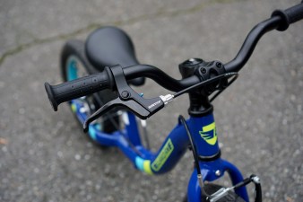 Hand brake lever on blue Guardian Balance Bike.