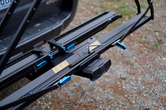 Bolting on the final bike tray on the RockyMounts AfterParty Swing Away hitch bike rack.