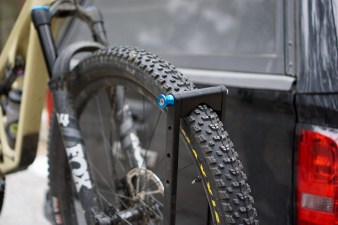 Mountain bike tire in the front tire cradle of the RockyMounts AfterParty Swing Away hitch rack.