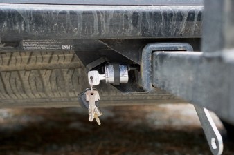 Keys dangling from lock on the hitch pin of the RockyMounts AfterParty Swing Away hitch rack.