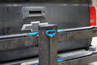 Close of the tilt lever on the RockyMounts AfterParty Swing Away hitch rack in the up position.